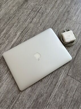 Apple Laptop in Silver with Charger Cord